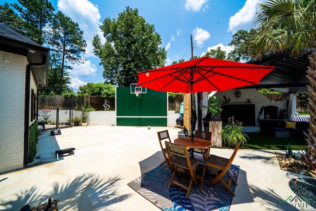 view of patio / terrace featuring outdoor dining area and fence