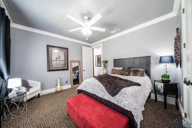 carpeted bedroom featuring ornamental molding, visible vents, baseboards, and a ceiling fan