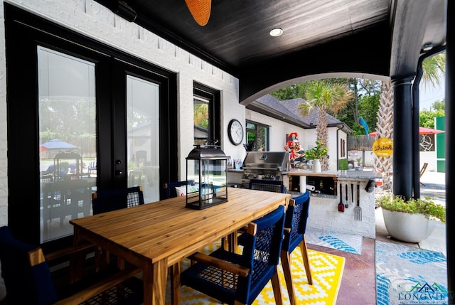 view of patio featuring outdoor dining space and a grill