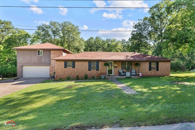view of front of house featuring concrete driveway, an attached garage, brick siding, and a front lawn