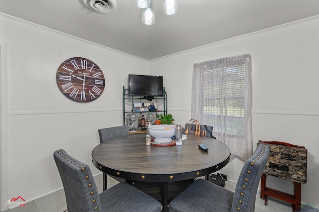 dining area featuring ornamental molding