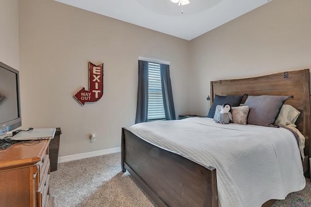 bedroom featuring carpet, a ceiling fan, and baseboards