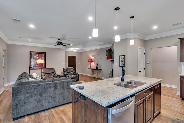 kitchen featuring dishwasher, visible vents, ceiling fan, and a sink