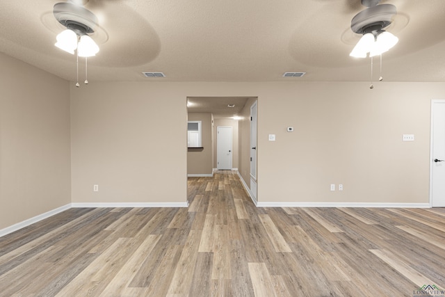 1001 Towne Lake Dr, Longview, TX 75601 - unfurnished room with a ceiling fan and wood finished floors
