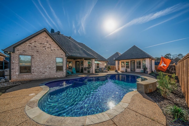 view of pool featuring a fenced in pool, a patio, a fenced backyard, an outbuilding, and an exterior structure