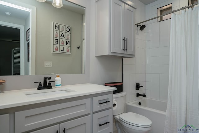 bathroom with toilet, shower / bath combo, and vanity