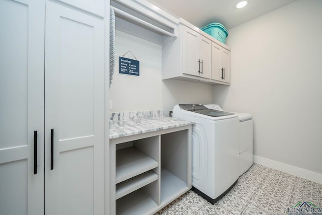 laundry area featuring light tile patterned floors, recessed lighting, cabinet space, separate washer and dryer, and baseboards