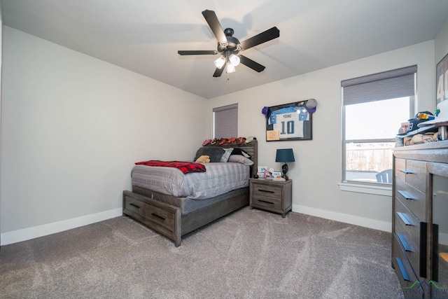 bedroom with carpet floors, a ceiling fan, and baseboards