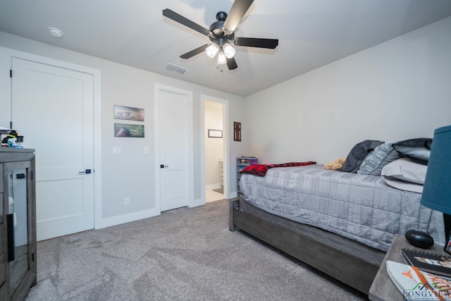 bedroom featuring light carpet, a ceiling fan, visible vents, and baseboards