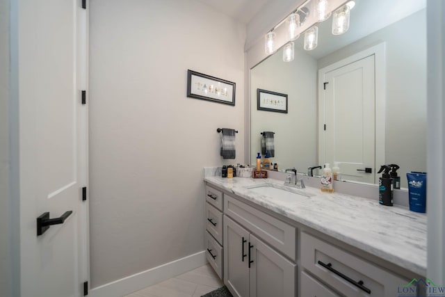 bathroom featuring vanity and baseboards