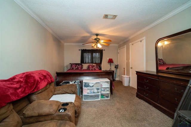 bedroom featuring crown molding, light colored carpet, and a textured ceiling