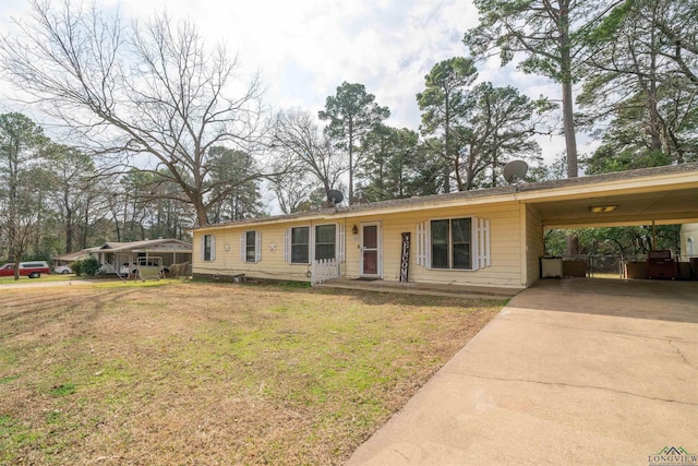 ranch-style house with a front yard and a carport