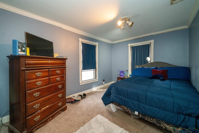 bedroom with ornamental molding and carpet