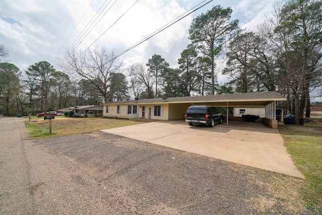 view of front of house featuring a front yard and a carport