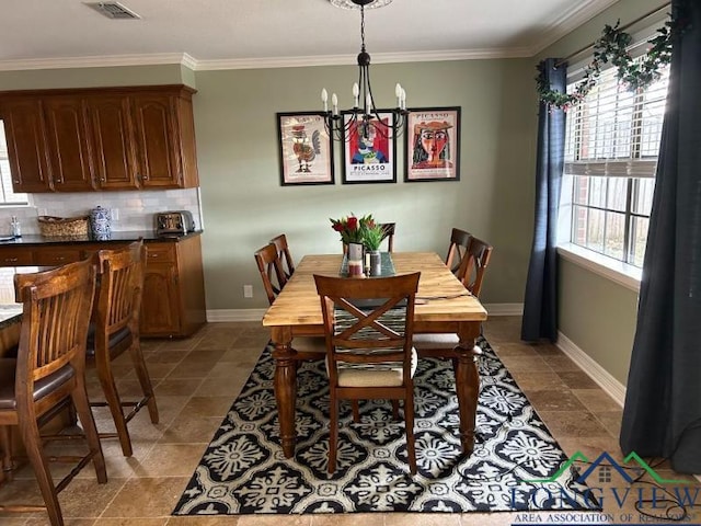 1203 Tiffany Ln, Longview, TX 75604 - tiled dining area with a chandelier and ornamental molding
