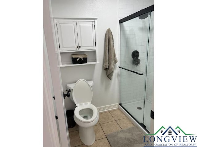 1203 Tiffany Ln, Longview, TX 75604 - bathroom with a stall shower and tile patterned floors