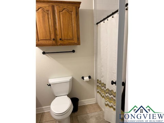1203 Tiffany Ln, Longview, TX 75604 - full bath with tile patterned flooring and curtained shower