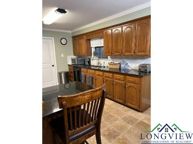 1203 Tiffany Ln, Longview, TX 75604 - kitchen with black dishwasher, ornamental molding, stainless steel microwave, brown cabinetry, and dark stone countertops