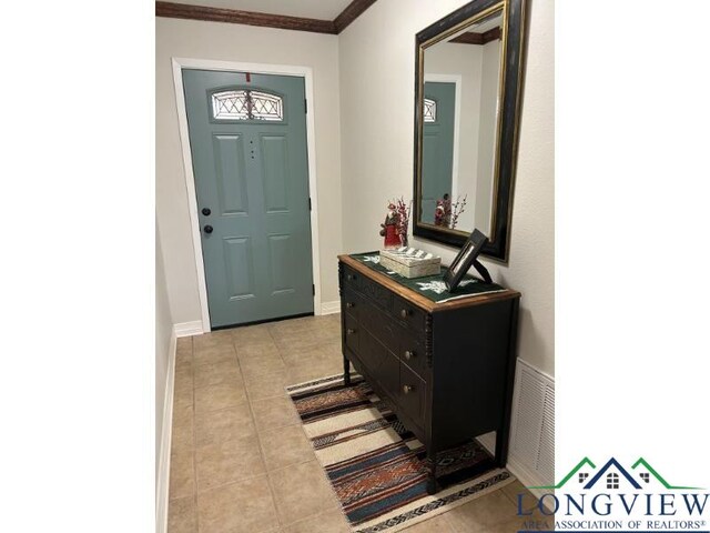 1203 Tiffany Ln, Longview, TX 75604 - entrance foyer with light tile patterned floors and ornamental molding