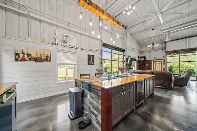 13391 County Road 4336, Larue, TX 75770 - kitchen with wood counters, concrete floors, wine cooler, open floor plan, and a chandelier
