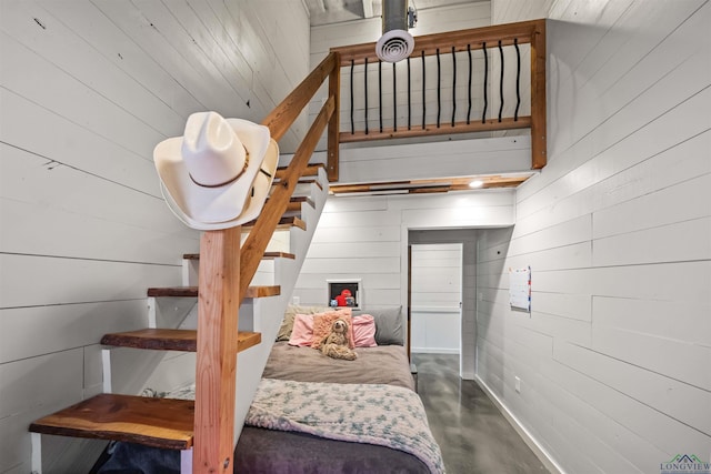 13391 County Road 4336, Larue, TX 75770 - stairway featuring wooden walls and finished concrete floors