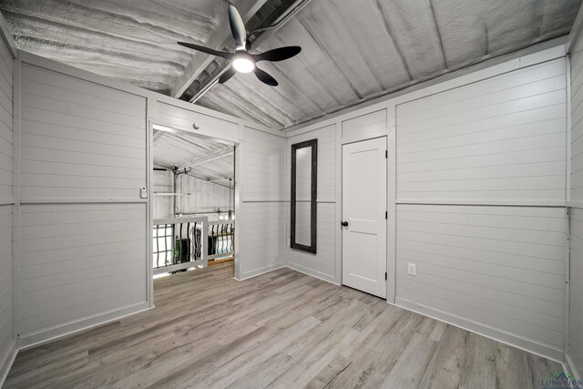 13391 County Road 4336, Larue, TX 75770 - unfurnished room with ceiling fan, wood finished floors, and wooden walls