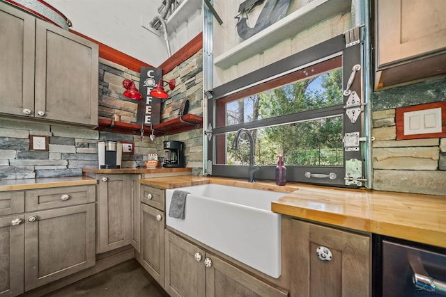 13391 County Road 4336, Larue, TX 75770 - kitchen featuring butcher block countertops, a sink, and concrete flooring