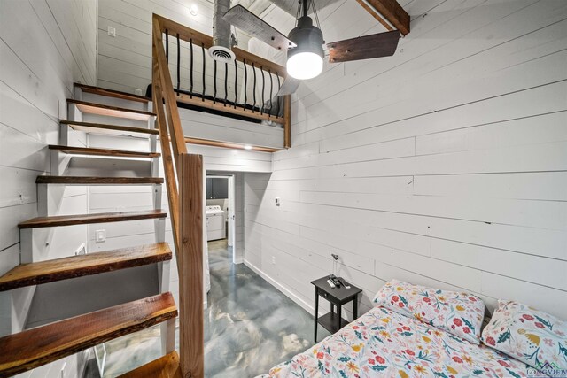 13391 County Road 4336, Larue, TX 75770 - stairs with concrete floors, washer / dryer, wood walls, and a ceiling fan