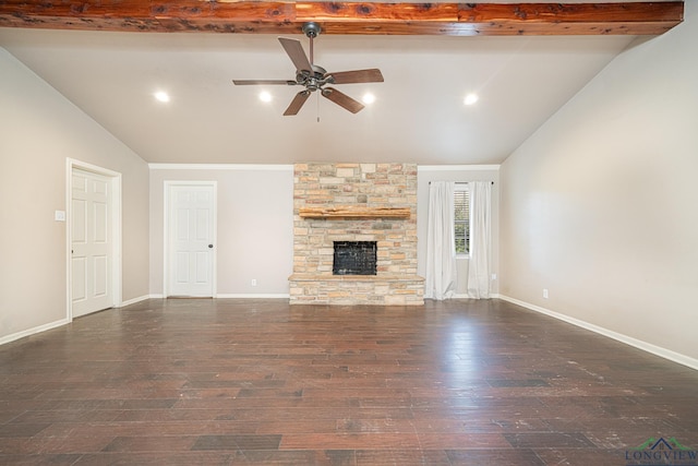 unfurnished living room featuring ceiling fan, a stone fireplace, vaulted ceiling with beams, and dark hardwood / wood-style floors