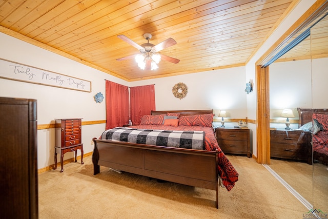 bedroom with ceiling fan, ornamental molding, wood ceiling, and light carpet