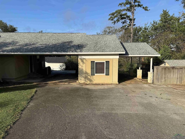 garage featuring a carport