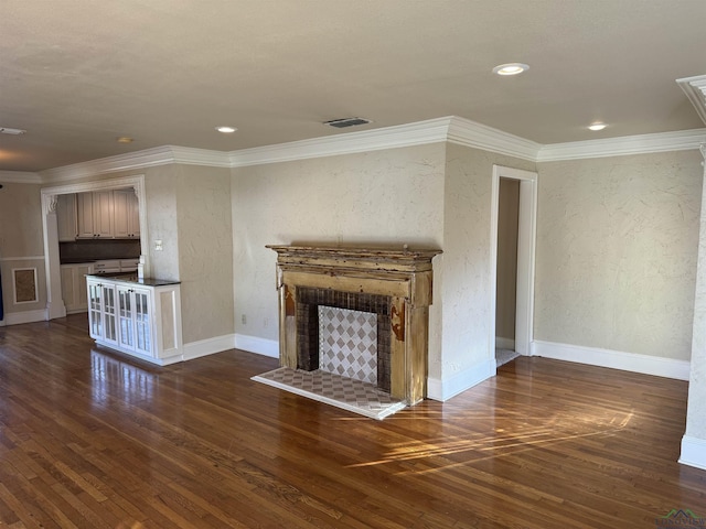 unfurnished living room featuring ornamental molding and dark wood-type flooring