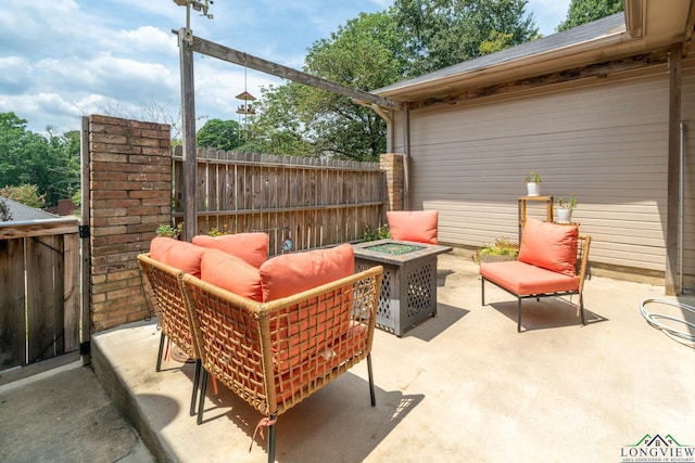 view of patio / terrace featuring an outdoor living space with a fire pit