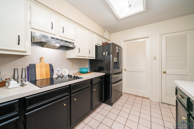 kitchen with white cabinets, black electric stovetop, stainless steel refrigerator with ice dispenser, and light tile patterned floors