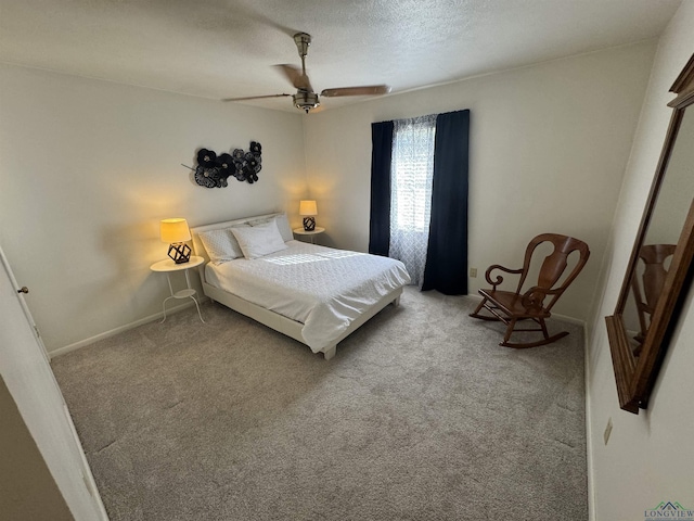 bedroom with ceiling fan and light carpet