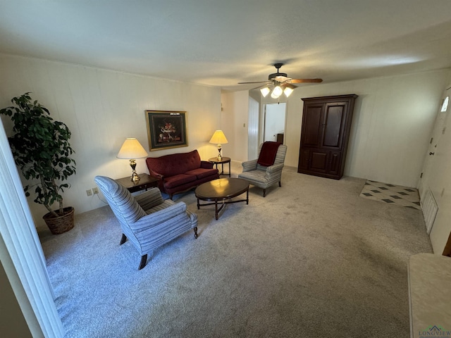 living room featuring ceiling fan and light colored carpet