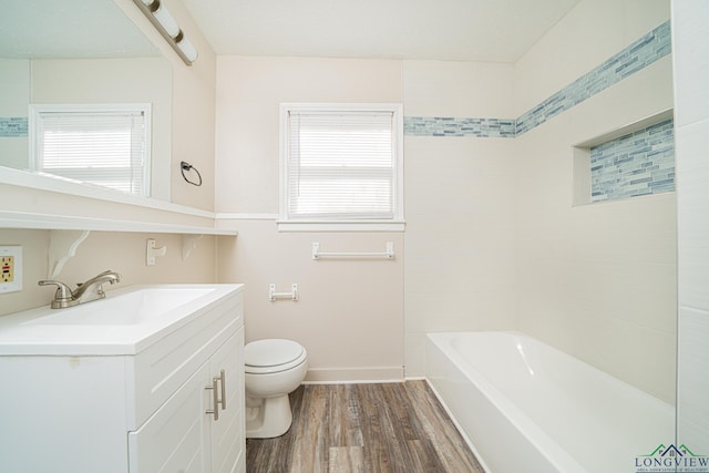 bathroom featuring vanity, toilet, and wood-type flooring