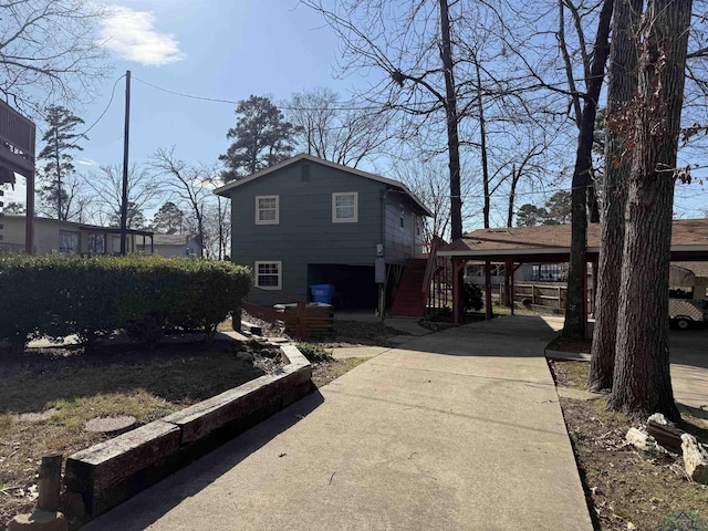 exterior space with driveway and stairway