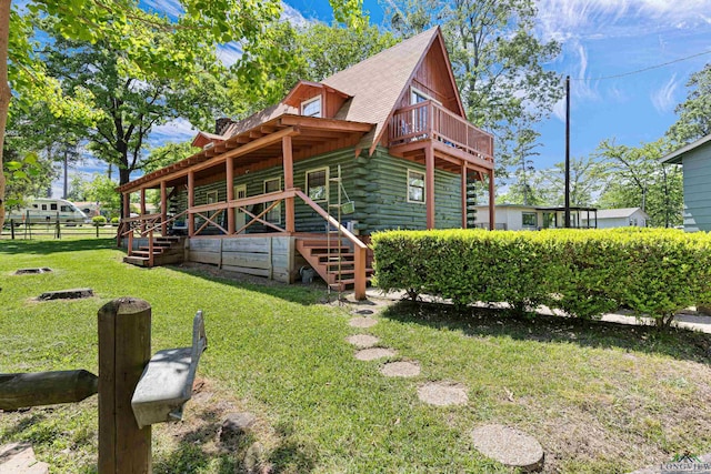 111 Inwood St, Avinger, TX 75630 - exterior space featuring stairway, fence, log siding, and a yard