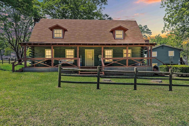111 Inwood St, Avinger, TX 75630 - log cabin with fence, a porch, and log siding