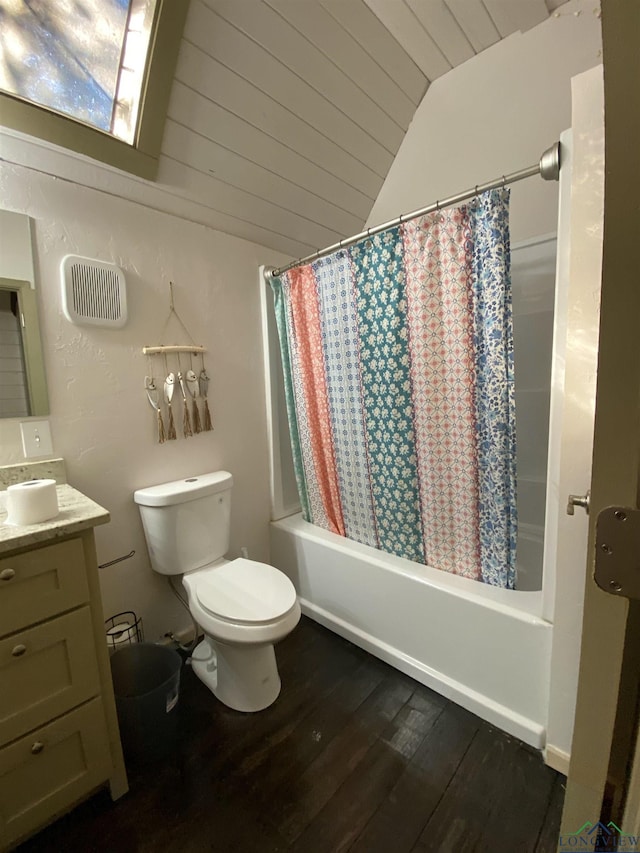 full bath with lofted ceiling, visible vents, toilet, vanity, and wood finished floors