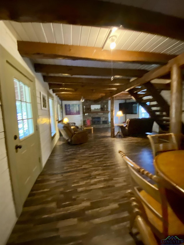 interior space featuring wood ceiling, dark wood finished floors, and beam ceiling