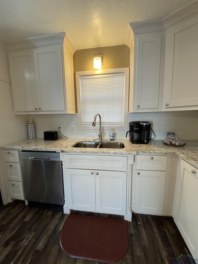 kitchen featuring stainless steel dishwasher, dark wood-style floors, white cabinets, and a sink