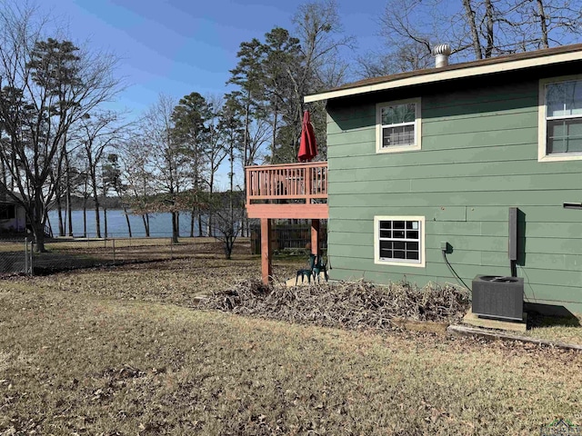 exterior space with a water view and central AC unit