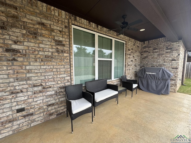 view of patio with a grill and ceiling fan