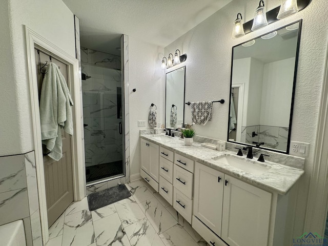 bathroom featuring a textured ceiling, a sink, a textured wall, a marble finish shower, and marble finish floor