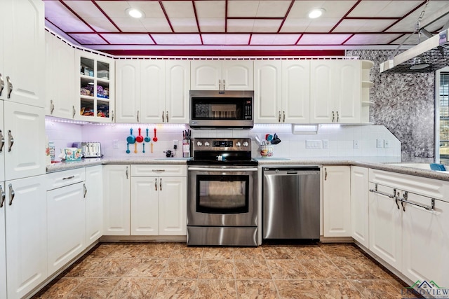 kitchen featuring glass insert cabinets, appliances with stainless steel finishes, white cabinetry, backsplash, and recessed lighting