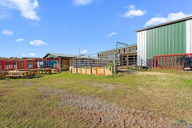 view of yard with an exterior structure and an outbuilding