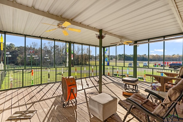 sunroom featuring a ceiling fan