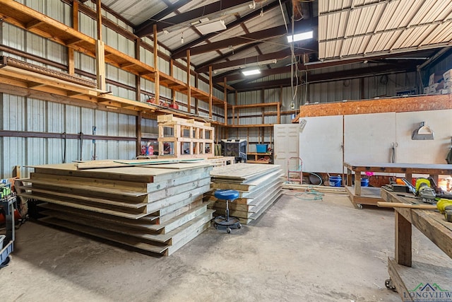 garage with a workshop area and metal wall